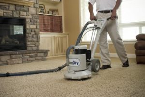 worker performing affordable carpet cleaning in Carlsbad